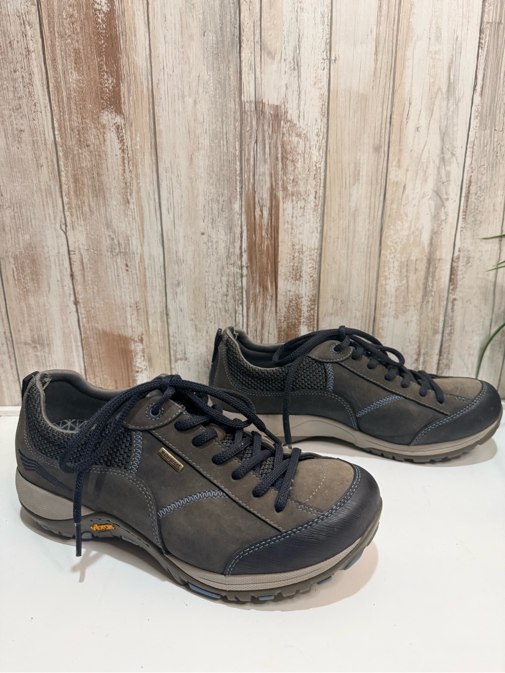 Dansko Paisley Waterproof Sneakers in a brown or grayish-taupe suede colorway